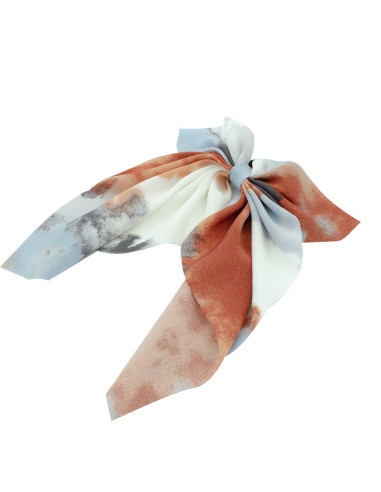 Coletero pañuelo con lazo en tejido de gasa con estampado tipo acuarela en tonos naranja, azul y gris